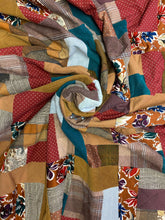 Load image into Gallery viewer, close-up-of-swirl-of-clothing-memory-quilt-by-julie-moss-replay-quilts